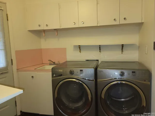 a utility room with dryer and washer