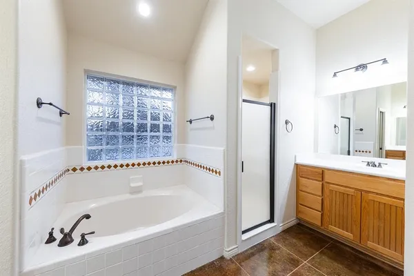 a bathroom with a bathtub and a sink
