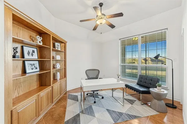 a living room with furniture a rug and a window