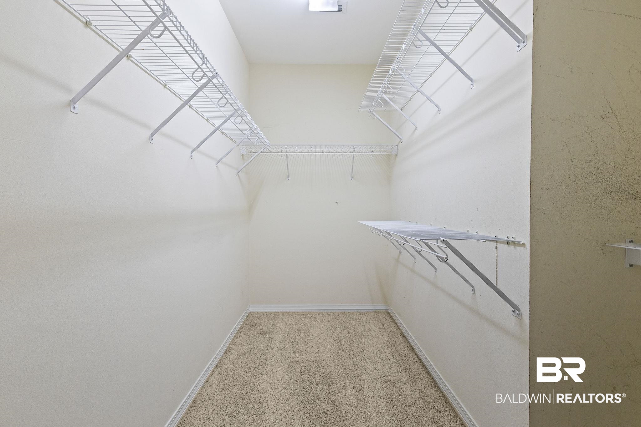 166 Club Drive Fairhope, AL 36532 - Photo 26 of 41 Walk in closet with carpet flooring