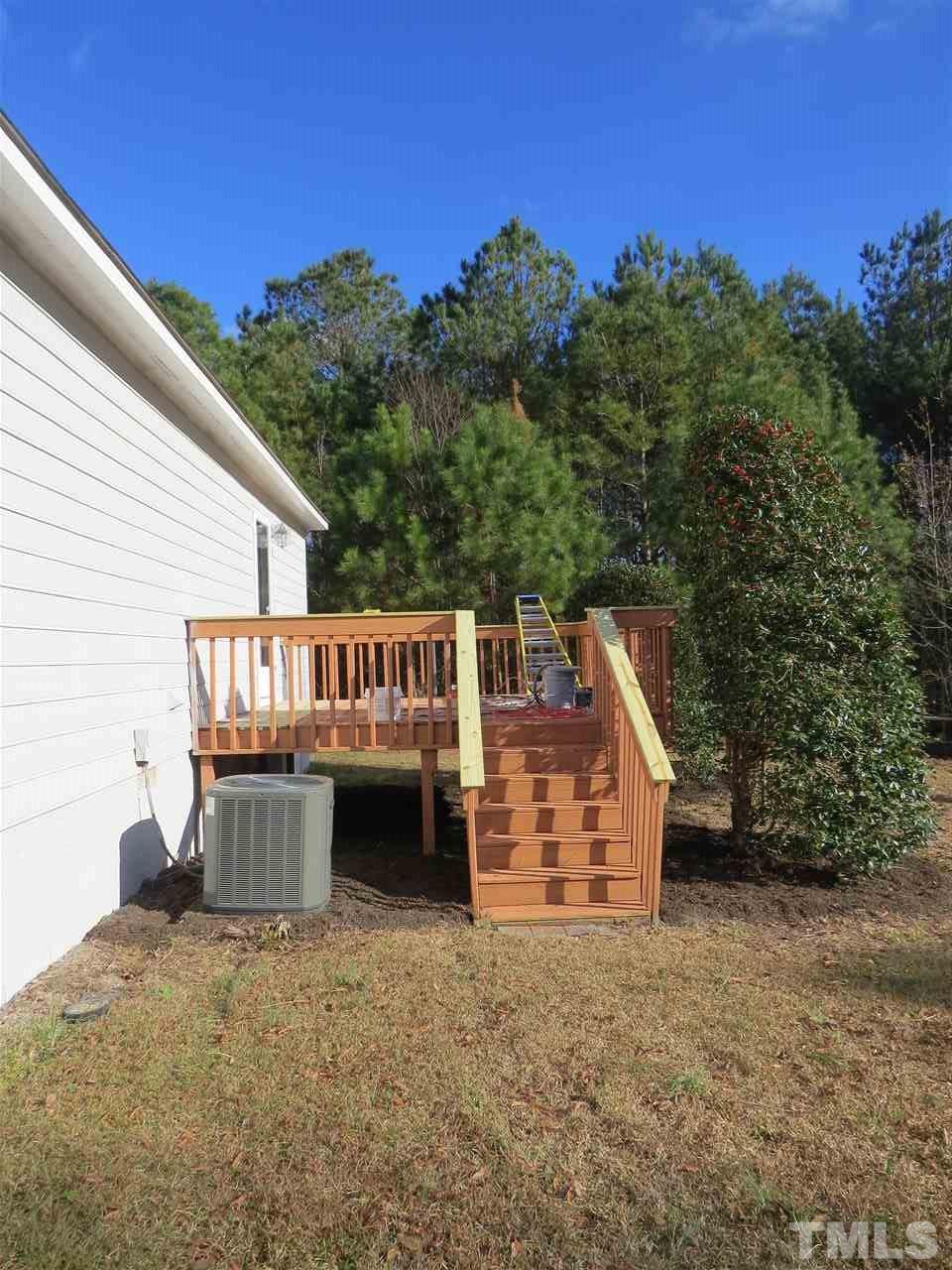 1578 Langdon Road Angier, NC 27501 - Photo 22 of 26 a view of a house with a yard