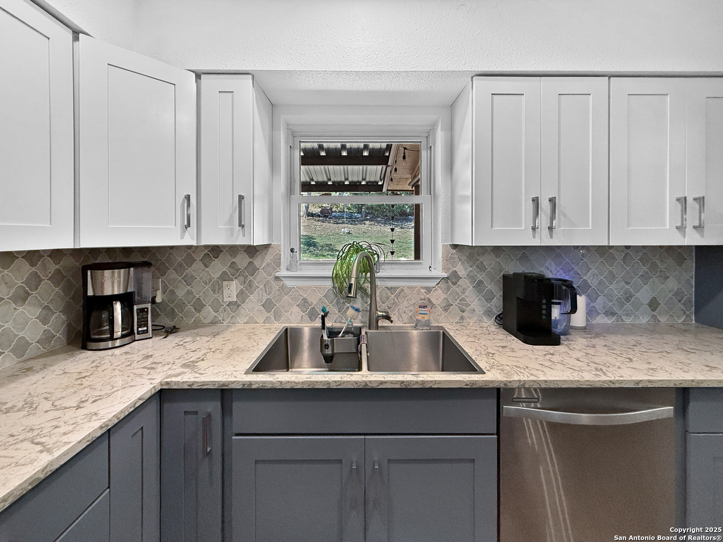 1406 Harper Road Kerrville, TX 78028 - Photo 14 of 33 a kitchen with a sink and cabinets