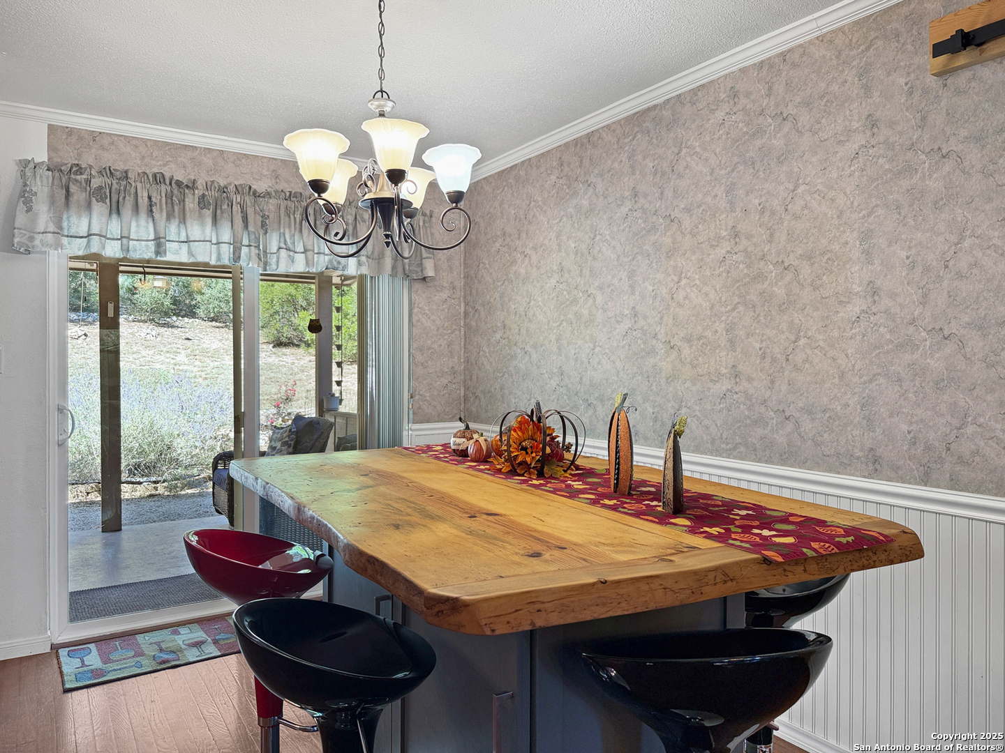 1406 Harper Road Kerrville, TX 78028 - Photo 16 of 33 a dining room with a table and chairs