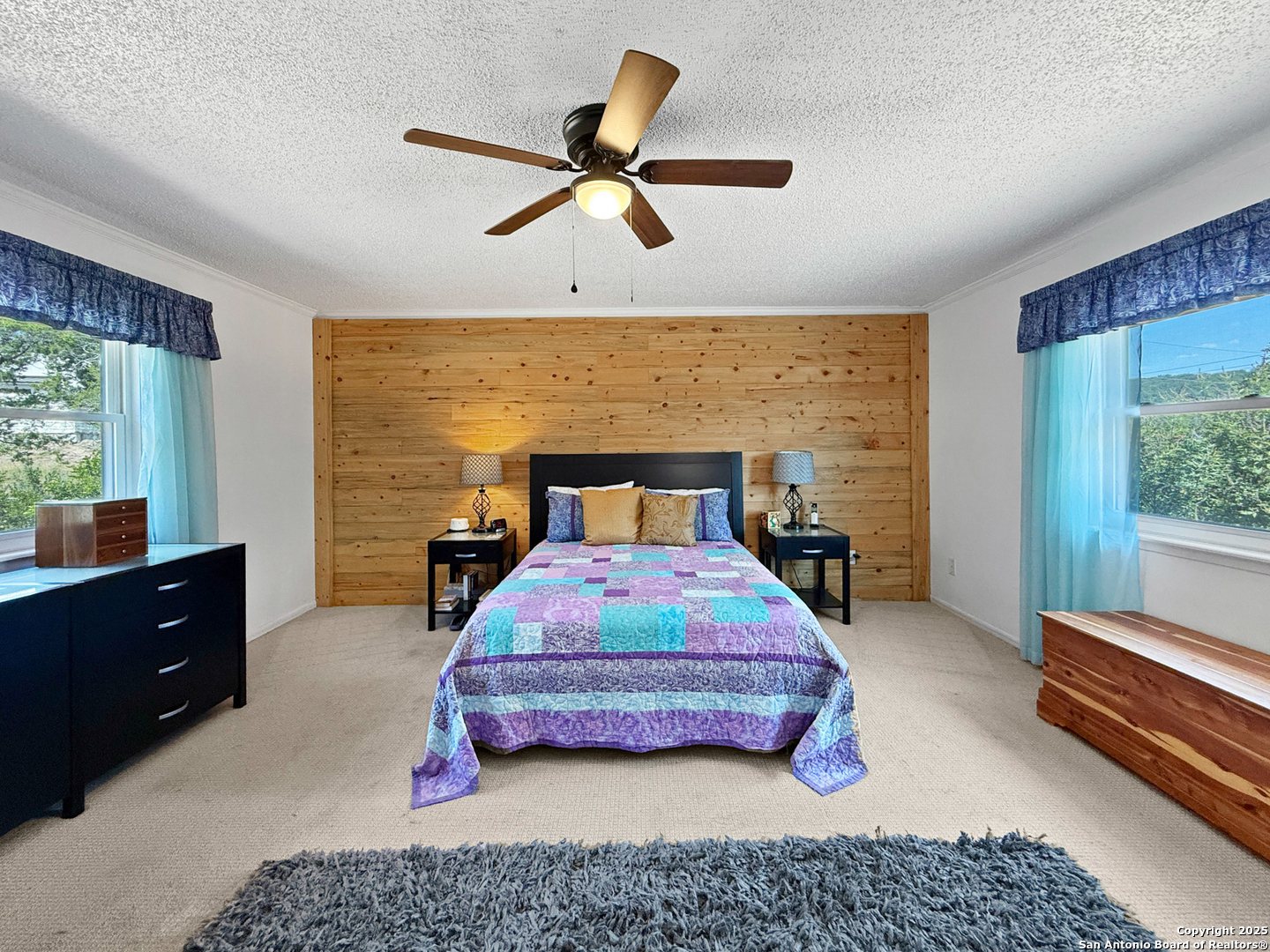 1406 Harper Road Kerrville, TX 78028 - Photo 19 of 33 a bedroom with a bed and a window