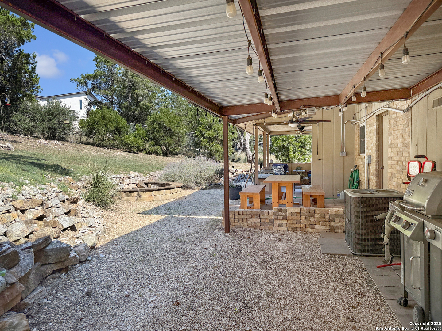 1406 Harper Road Kerrville, TX 78028 - Photo 28 of 33 a view of a patio with table and chairs and potted plants
