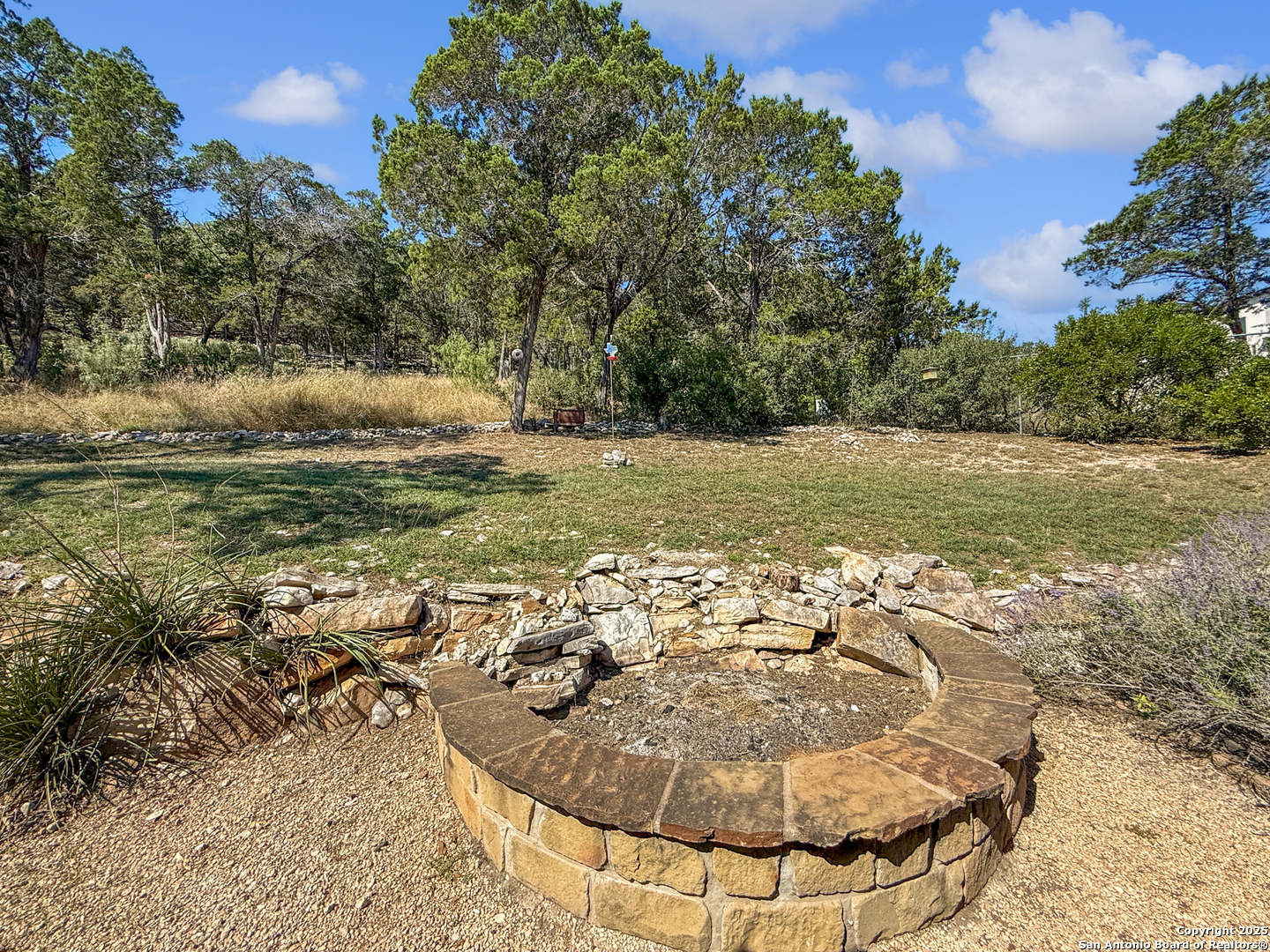 1406 Harper Road Kerrville, TX 78028 - Photo 29 of 33 a view of a backyard of a house