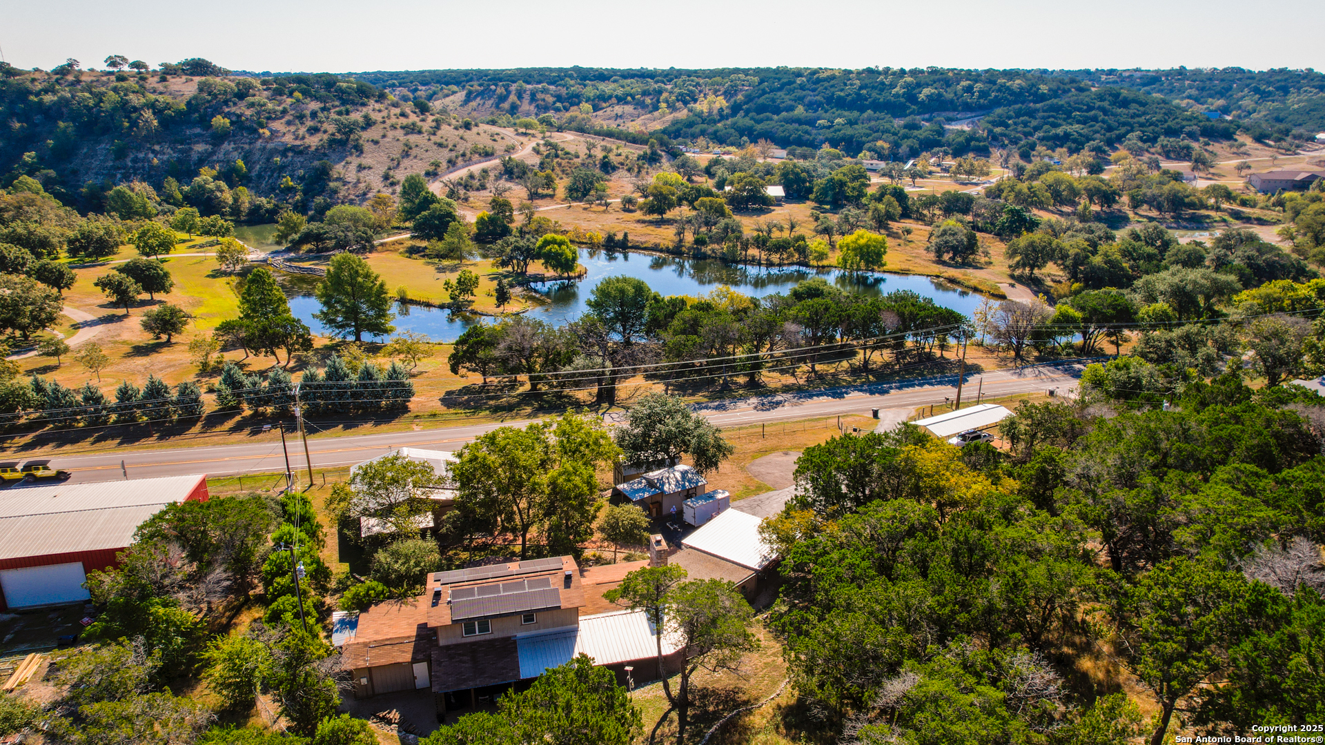 1406 Harper Road Kerrville, TX 78028 - Photo 33 of 33 an aerial view of residential houses with outdoor space and river