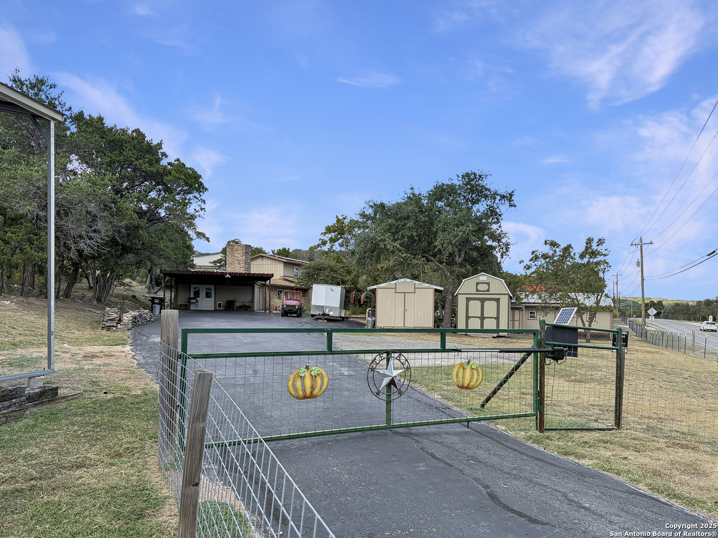 1406 Harper Road Kerrville, TX 78028 - Photo 5 of 33 a view of a swimming pool with a patio