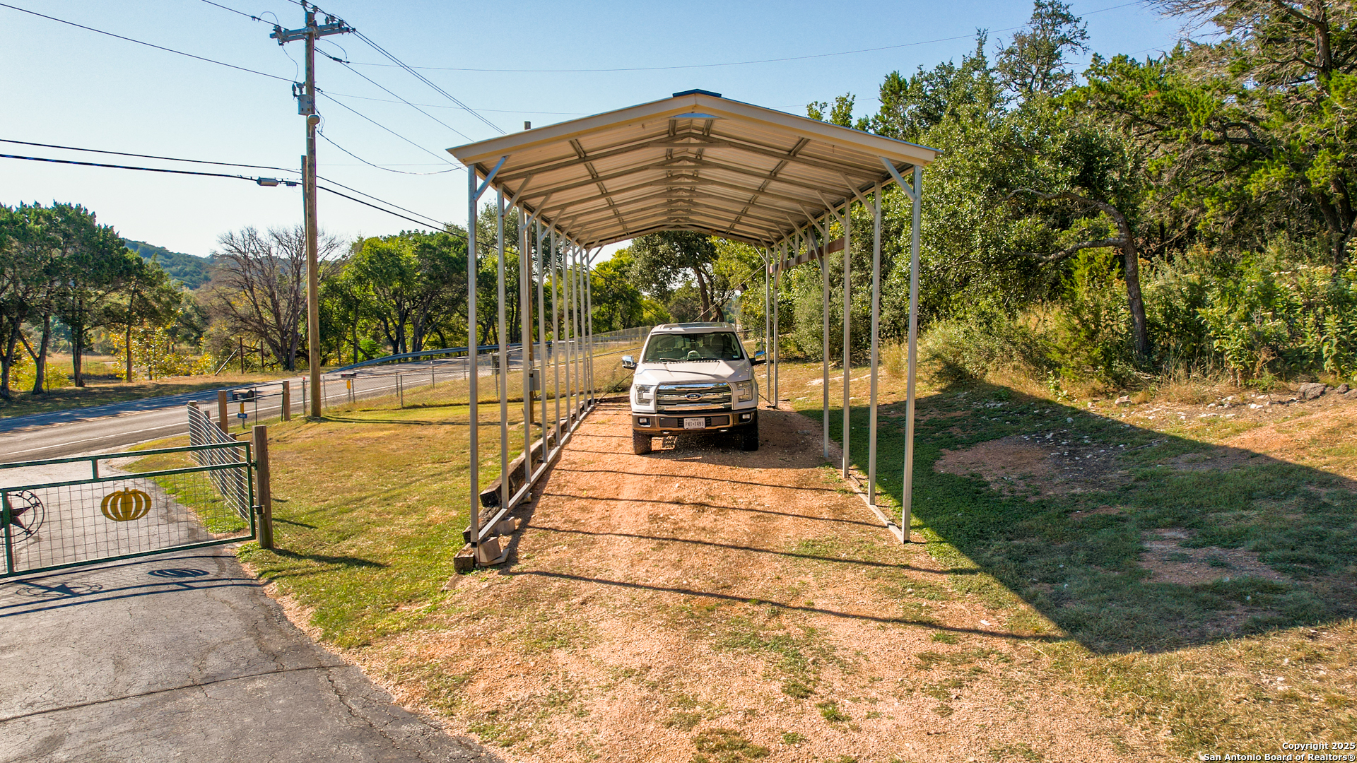 1406 Harper Road Kerrville, TX 78028 - Photo 6 of 33 a view of a swimming pool with a patio