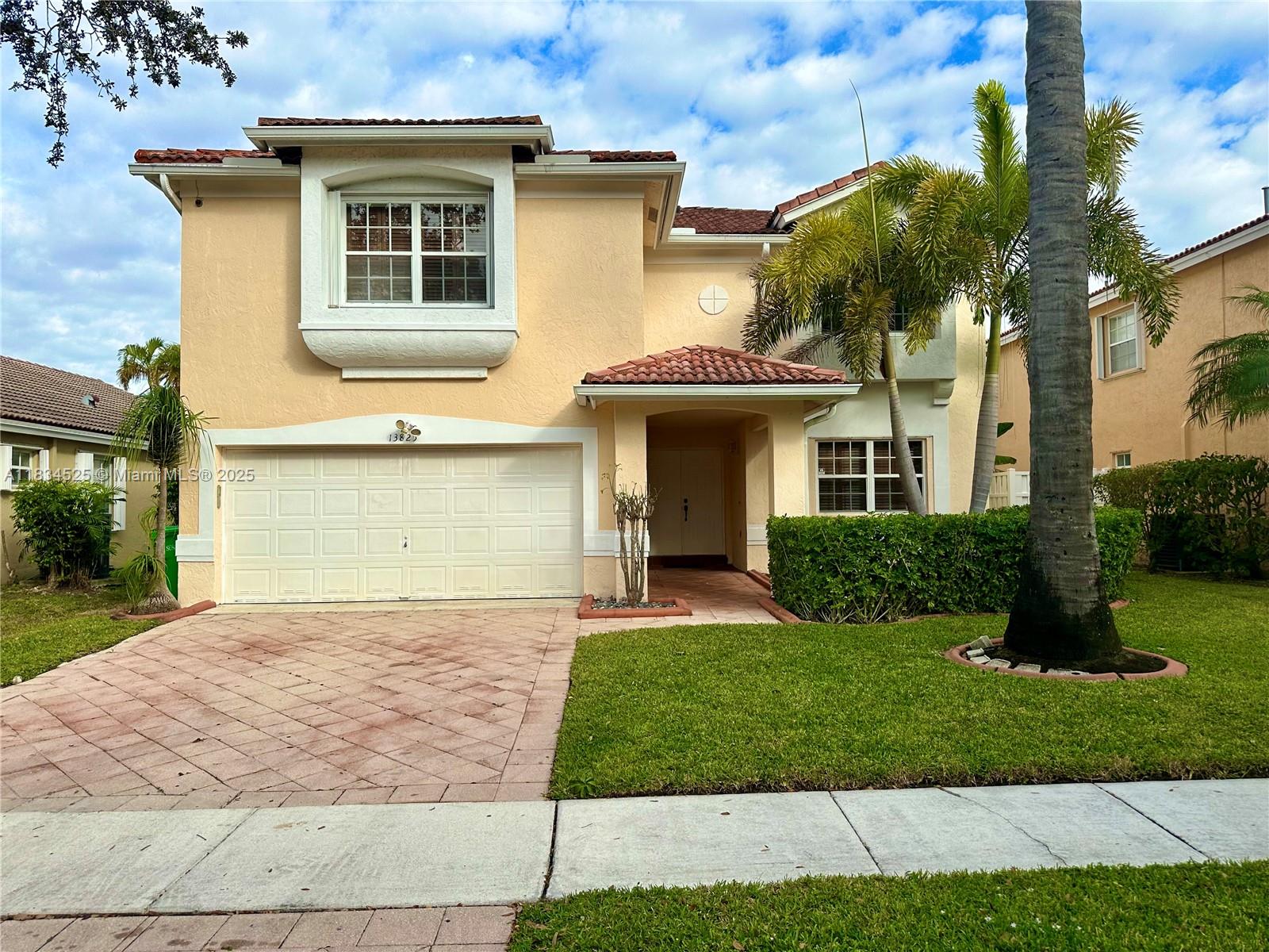 a view of a yard in front of a house