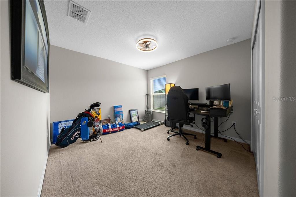 9329 Southwest 57th Terrace Ocala, FL 34476 - Photo 36 of 64 a view of a room with gym equipment