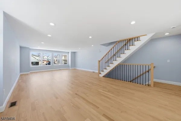 a view of gallery with wooden floor