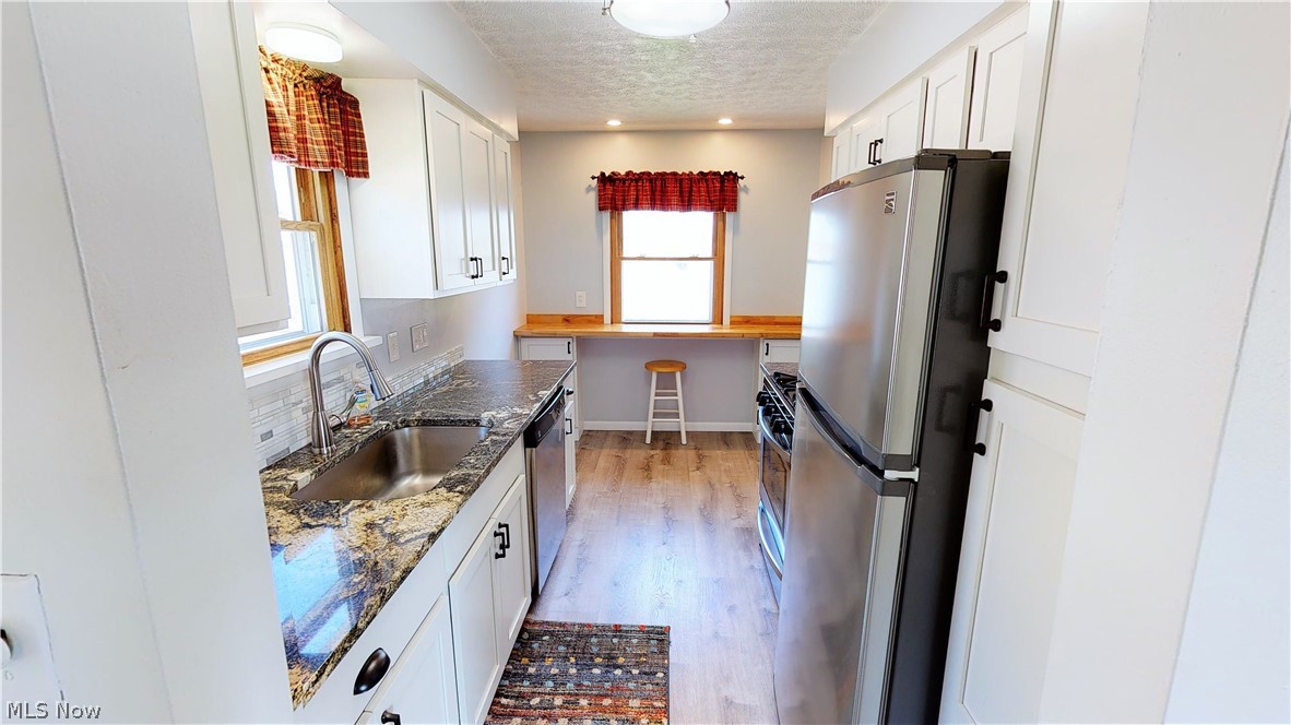 1575 Rush Road Wickliffe, OH 44092 - Photo 15 of 23 Completely Remodeled Kitchen with new cabinets, Granite Counters, and Included Stainless Steel Appliances