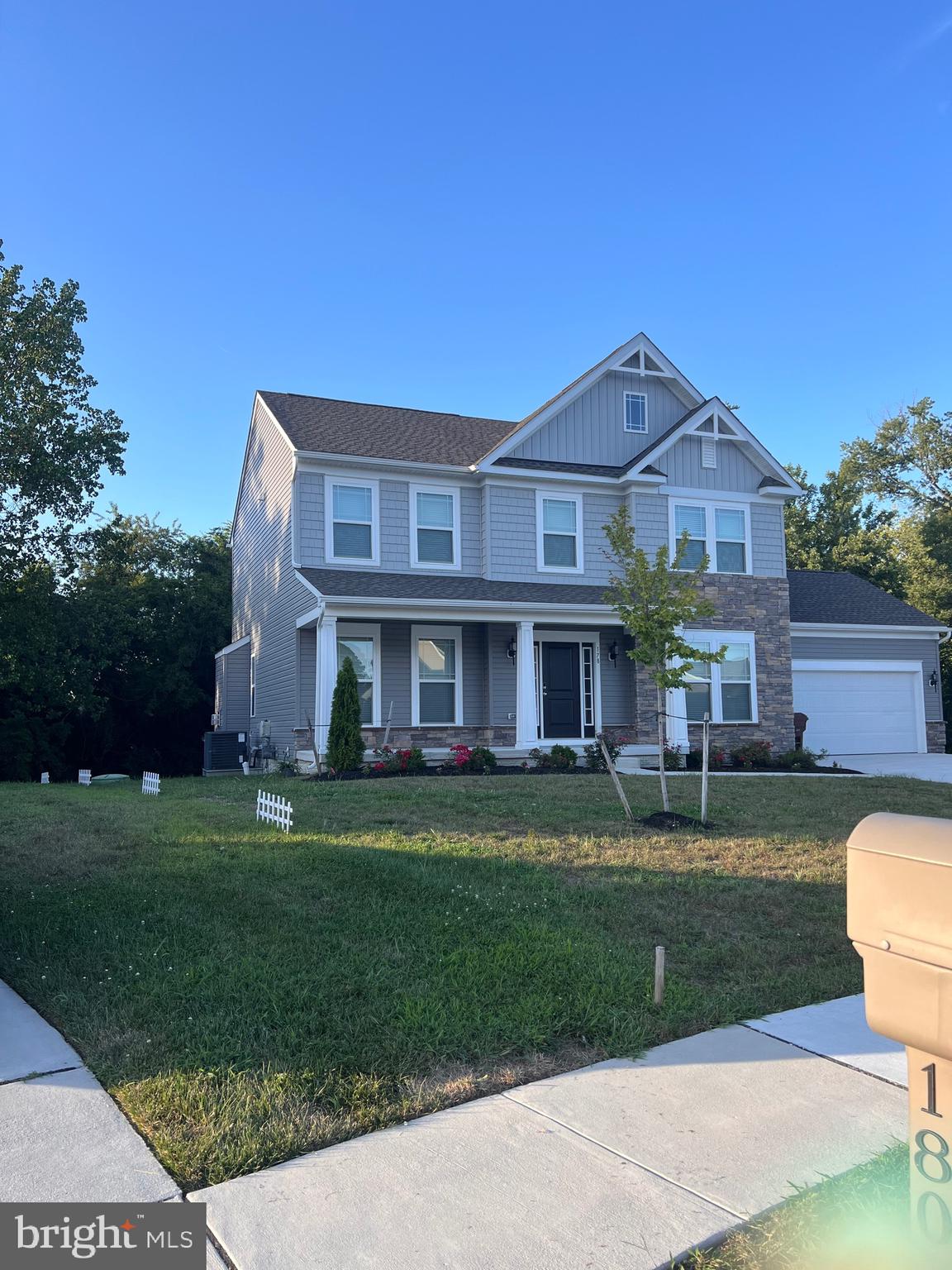 178 North Regulator Drive Cambridge, MD 21613 - Photo 2 of 18 a front view of a house with a garden