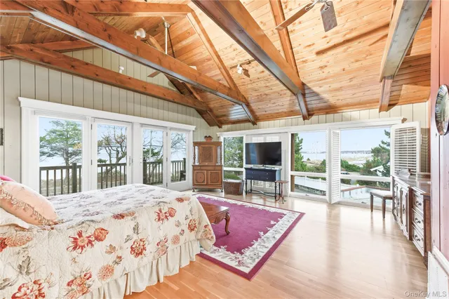 a bathroom with a toilet a sink and a window