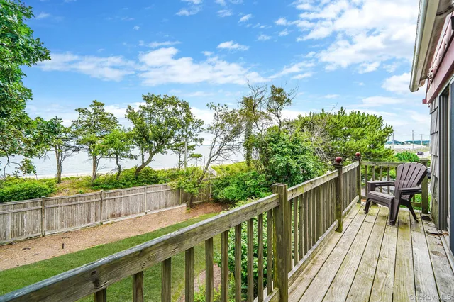 a bedroom with two beds and a table