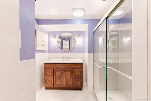 a bathroom with a shower curtain and a sink