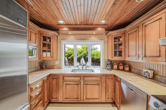 a kitchen with a refrigerator and a sink