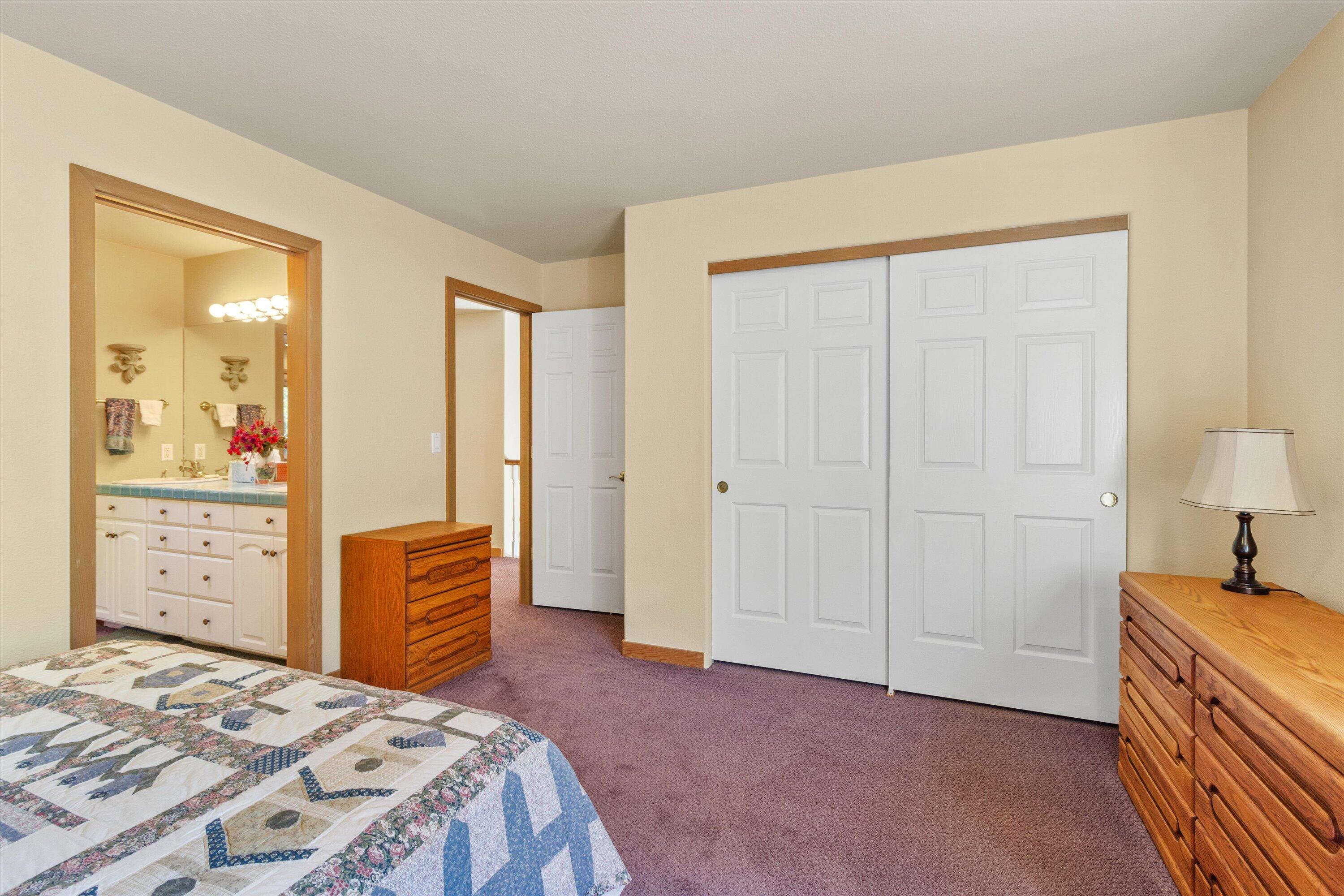 2801 Old Military Road Central Point, OR 97502 - Photo 35 of 49 a bedroom with a bed and a dresser
