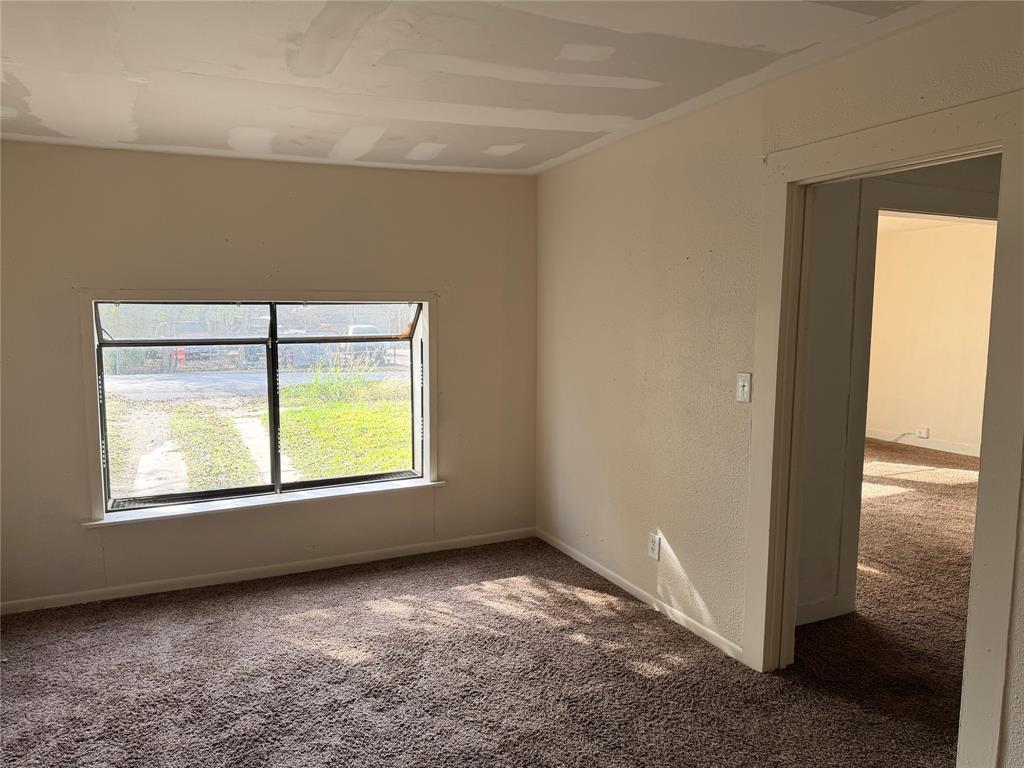 457 East James Street Wills Point, TX 75169 - Photo 11 of 14 a view of an empty room with a window