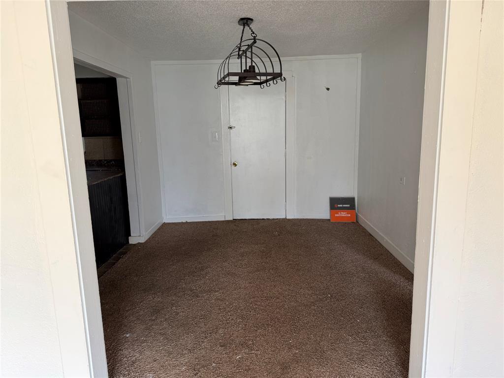 457 East James Street Wills Point, TX 75169 - Photo 3 of 14 a view of empty room with wooden floor