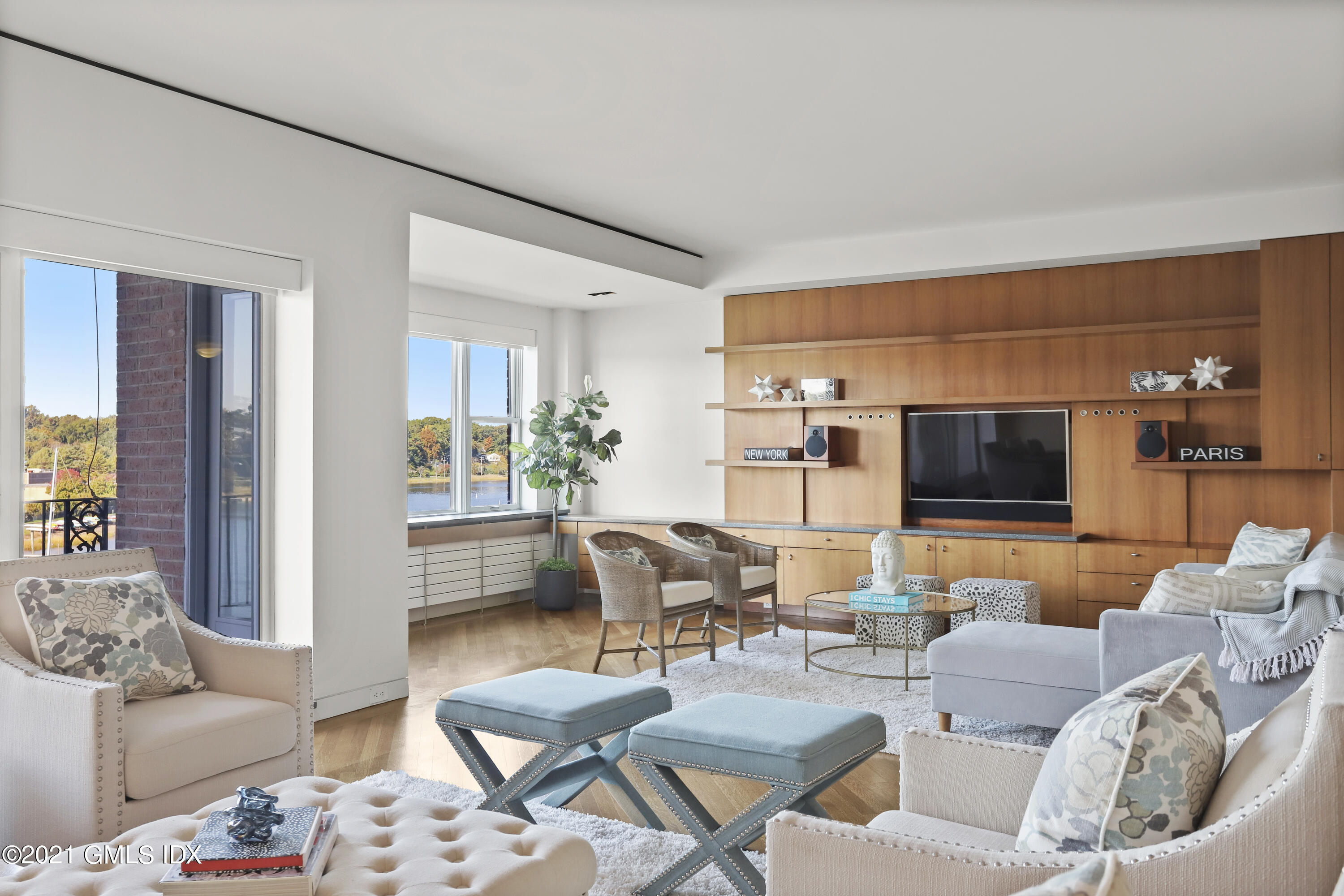 636 Steamboat Road, Unit 4A SOUTH Greenwich, CT 06830 - Photo 1 of 30 a living room with furniture and a flat screen tv