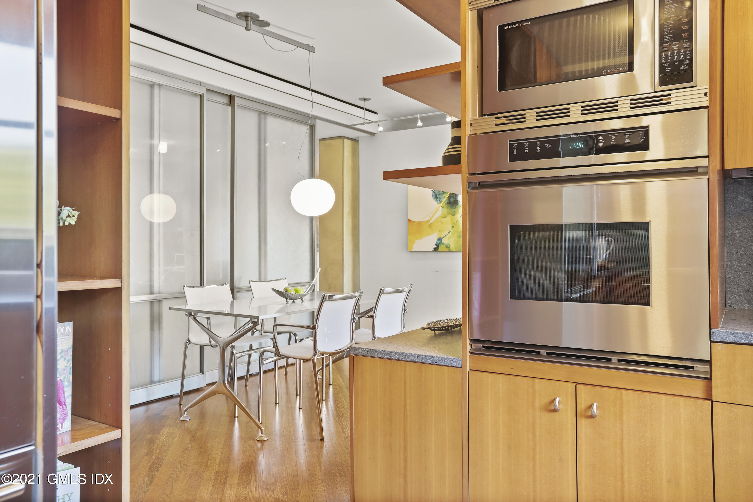 636 Steamboat Road, Unit 4A SOUTH Greenwich, CT 06830 - Photo 18 of 30 a view of a kitchen with furniture and flat screen tv