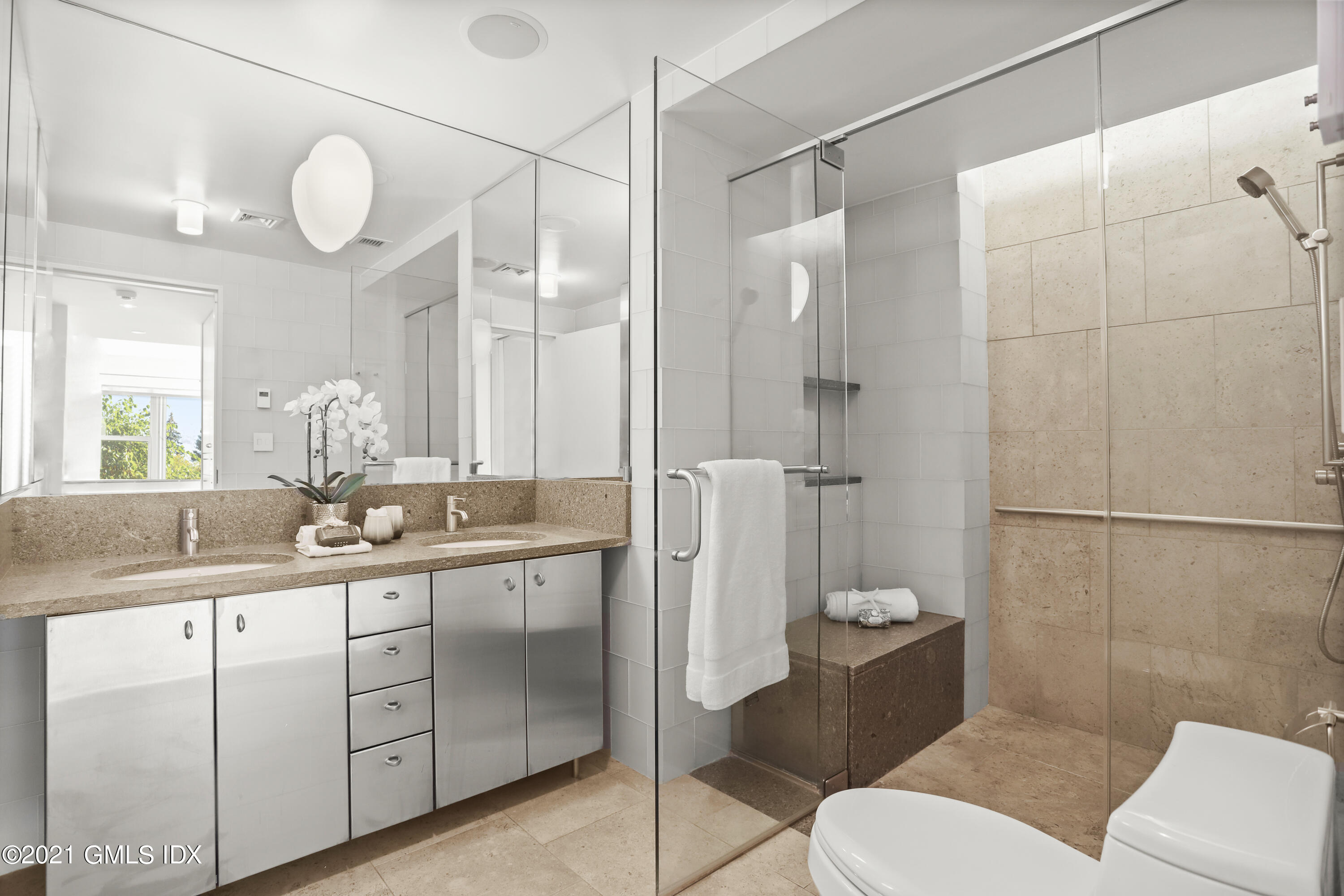 636 Steamboat Road, Unit 4A SOUTH Greenwich, CT 06830 - Photo 23 of 30 a bathroom with a sink a toilet and shower