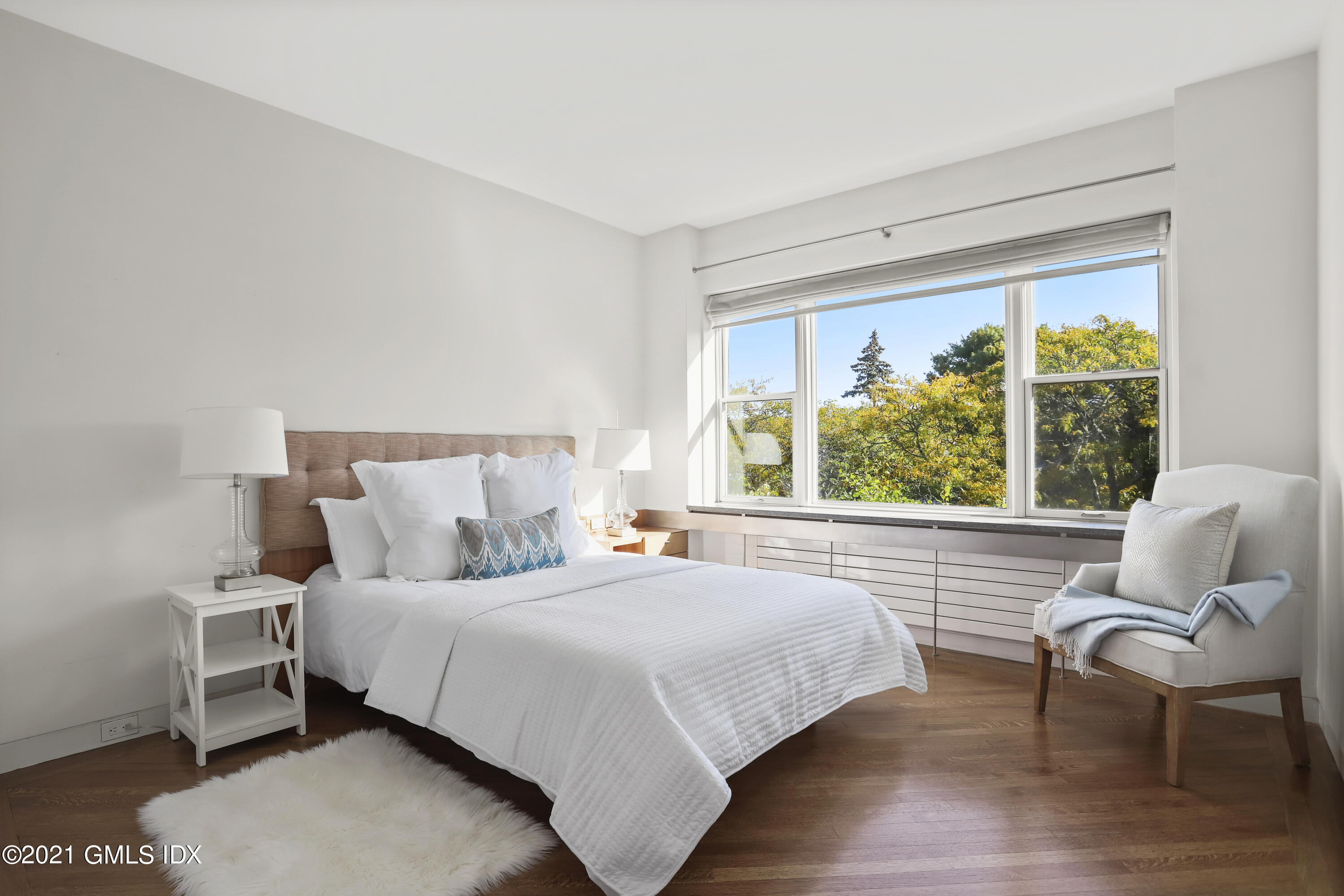 636 Steamboat Road, Unit 4A SOUTH Greenwich, CT 06830 - Photo 24 of 30 a bedroom with a bed chair and window