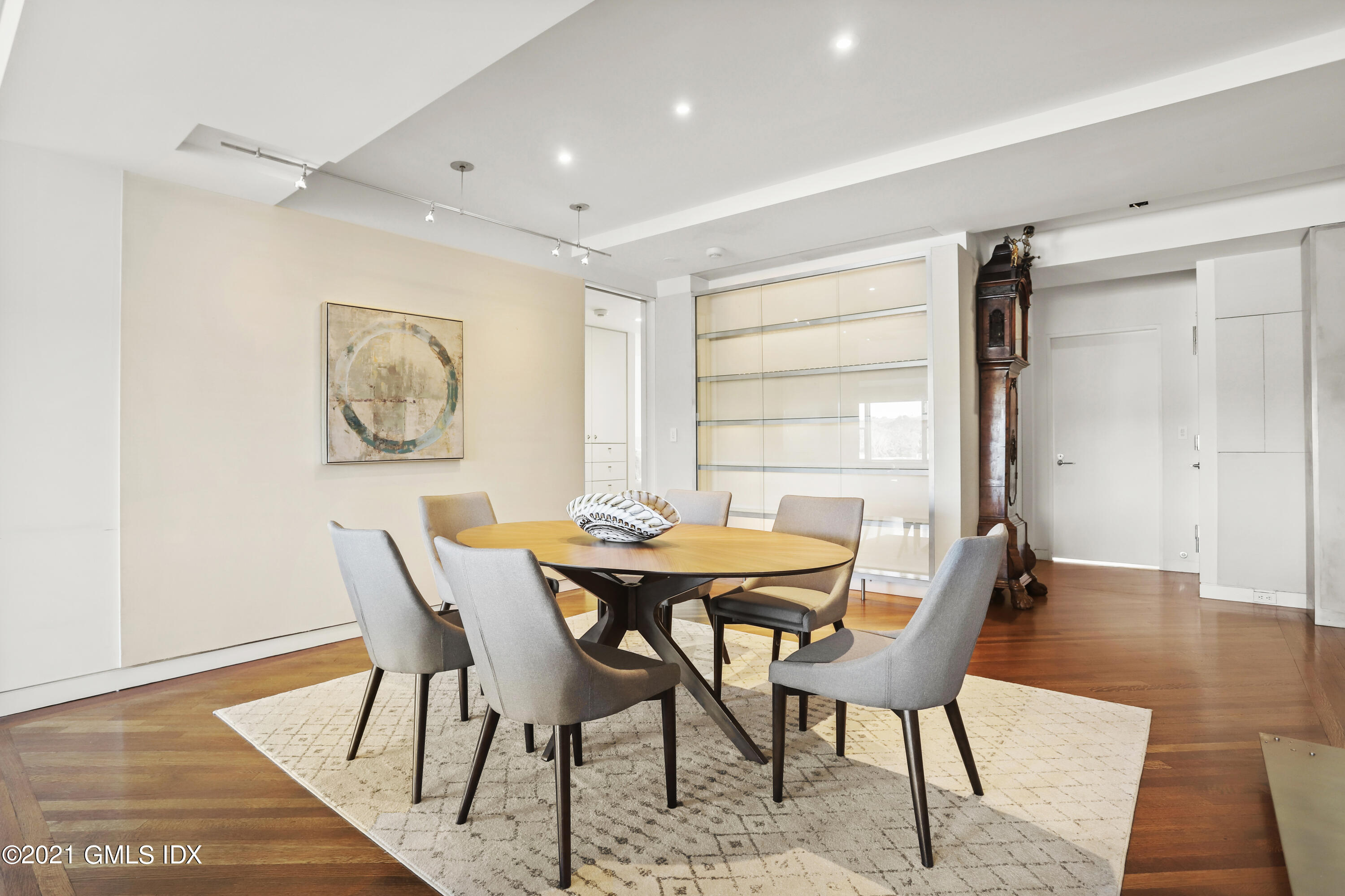 636 Steamboat Road, Unit 4A SOUTH Greenwich, CT 06830 - Photo 4 of 30 a view of a dining room with furniture and wooden floor