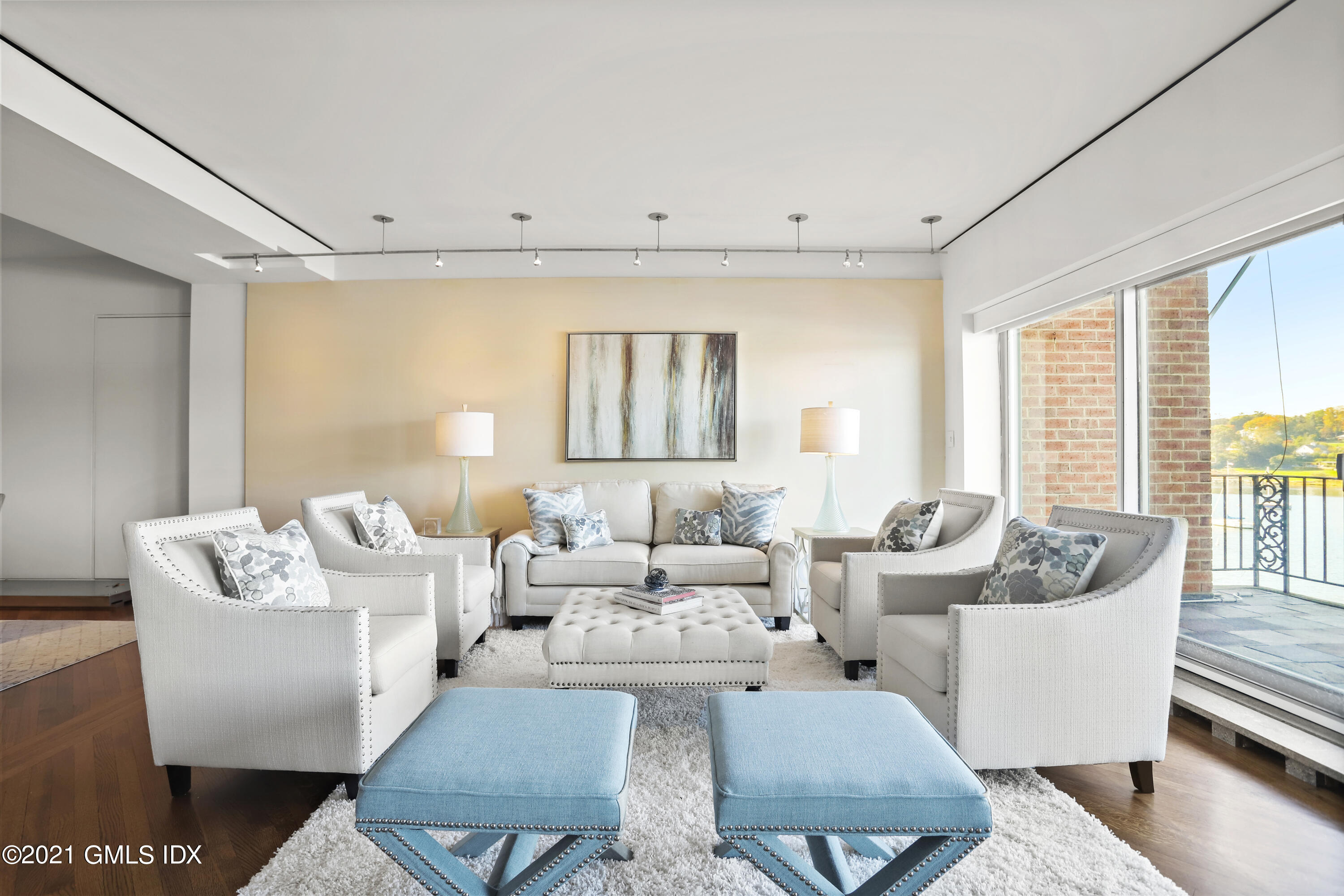 636 Steamboat Road, Unit 4A SOUTH Greenwich, CT 06830 - Photo 7 of 30 a living room with furniture and a large window