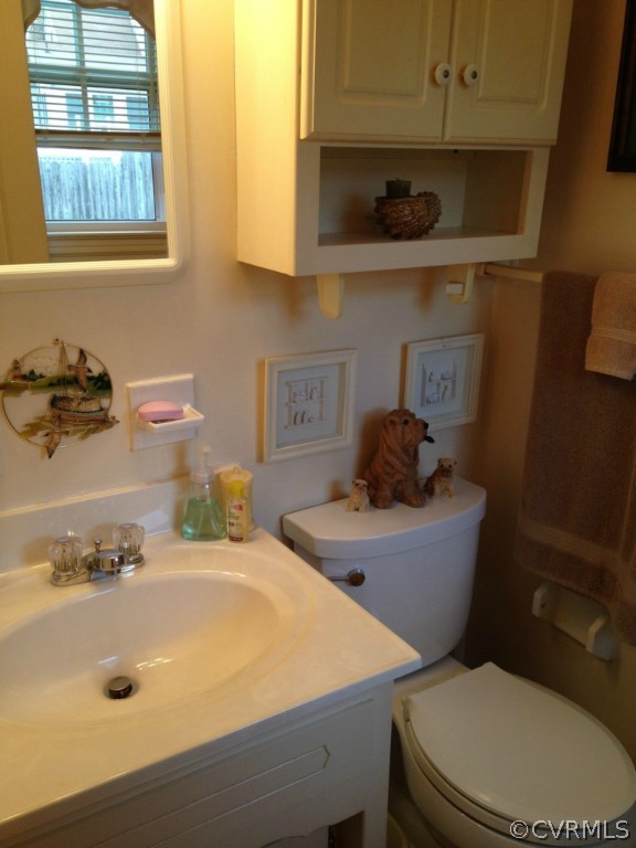 16131 Sandwave Road Chester, VA 23831 - Photo 15 of 24 a bathroom with a sink a window and toilet