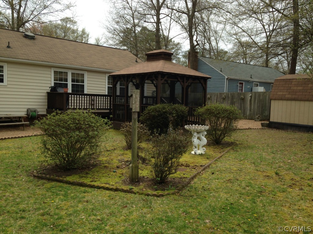 16131 Sandwave Road Chester, VA 23831 - Photo 20 of 24 a front view of house with yard and trees