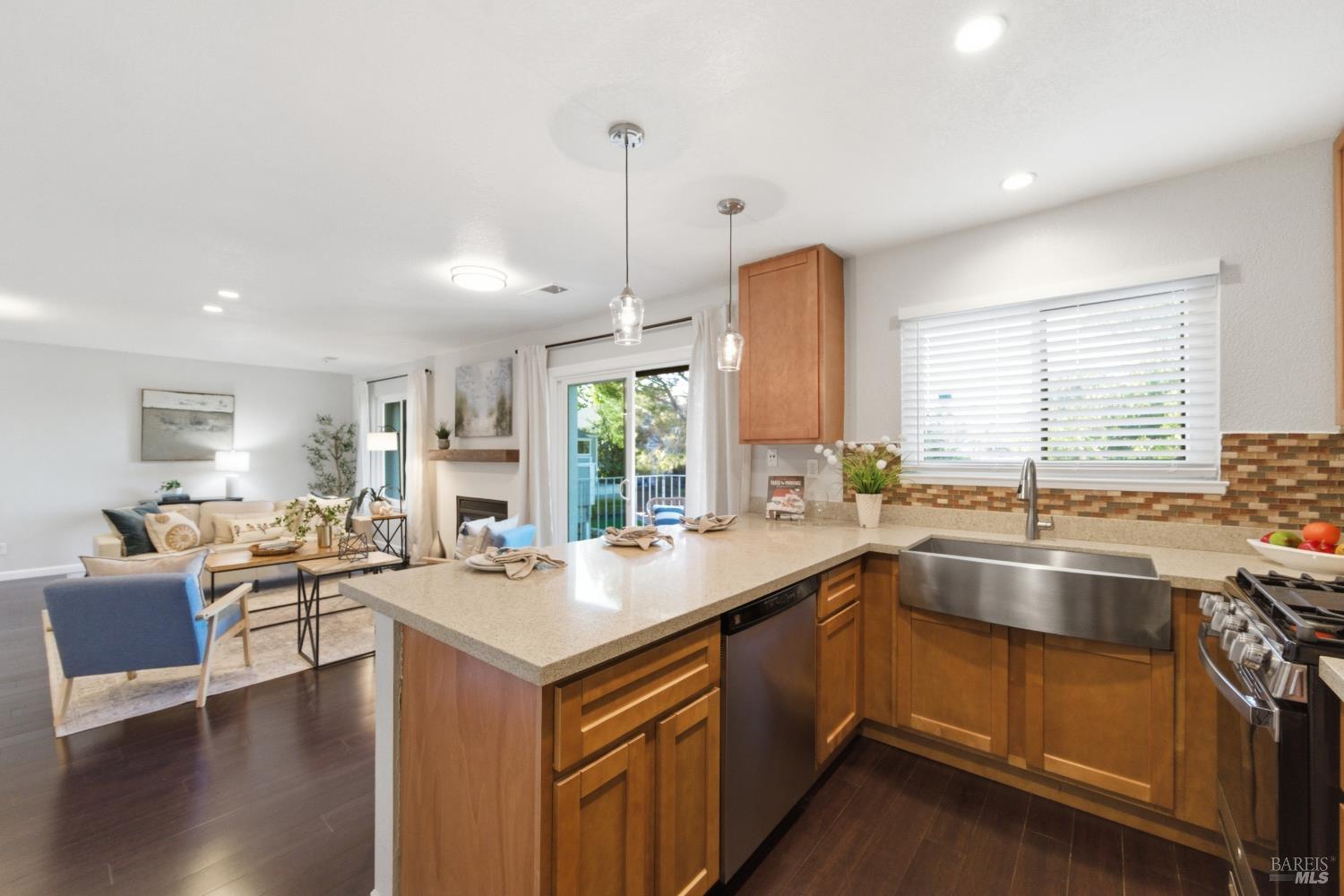 74 Hector Lane Novato, CA 94949 - Photo 17 of 32 a kitchen with a sink stove and wooden floor