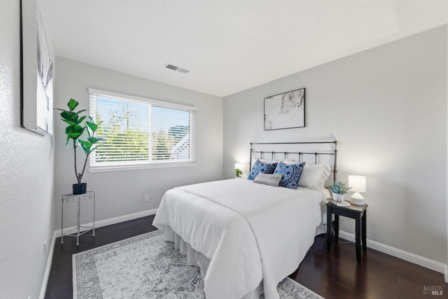 74 Hector Lane Novato, CA 94949 - Photo 23 of 32 a bedroom with a bed table and a window