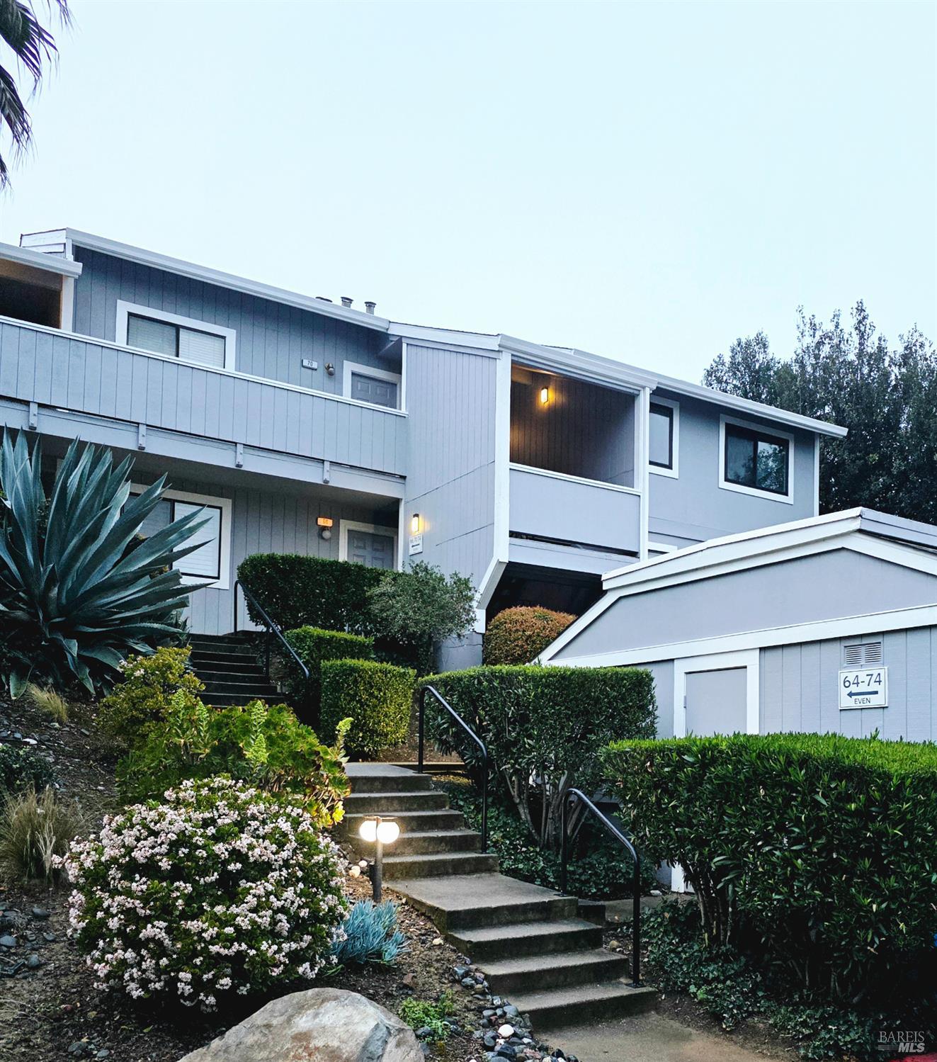 74 Hector Lane Novato, CA 94949 - Photo 6 of 32 a view of a house with wooden walls and potted plants