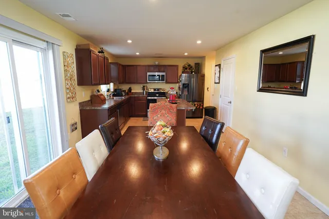 a living room with furniture fireplace and a flat screen tv