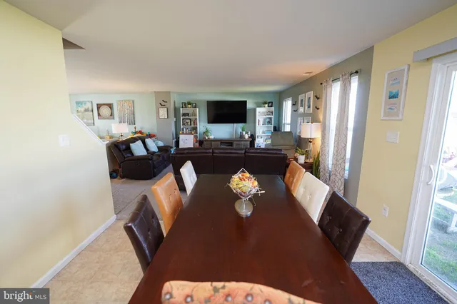 a kitchen with stainless steel appliances granite countertop a refrigerator a stove top oven a sink and dishwasher