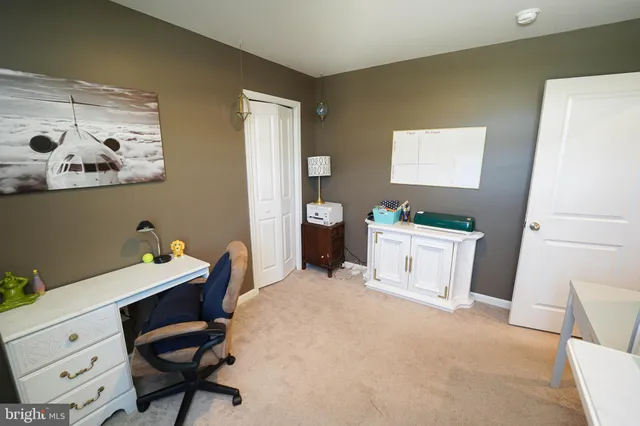 a bathroom with a black white checkered floor