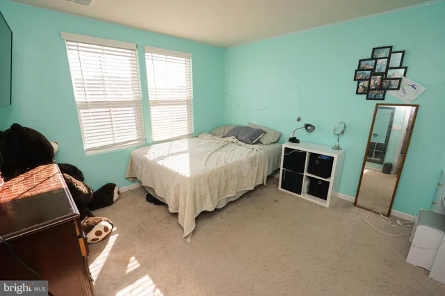 a bedroom with a bed and furniture