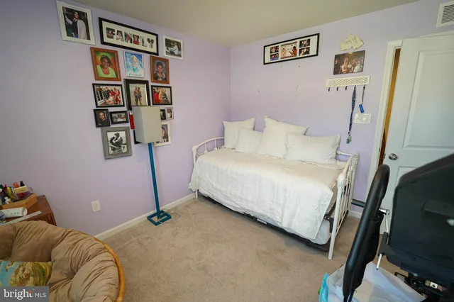 a bed room with a bed and trees in the background
