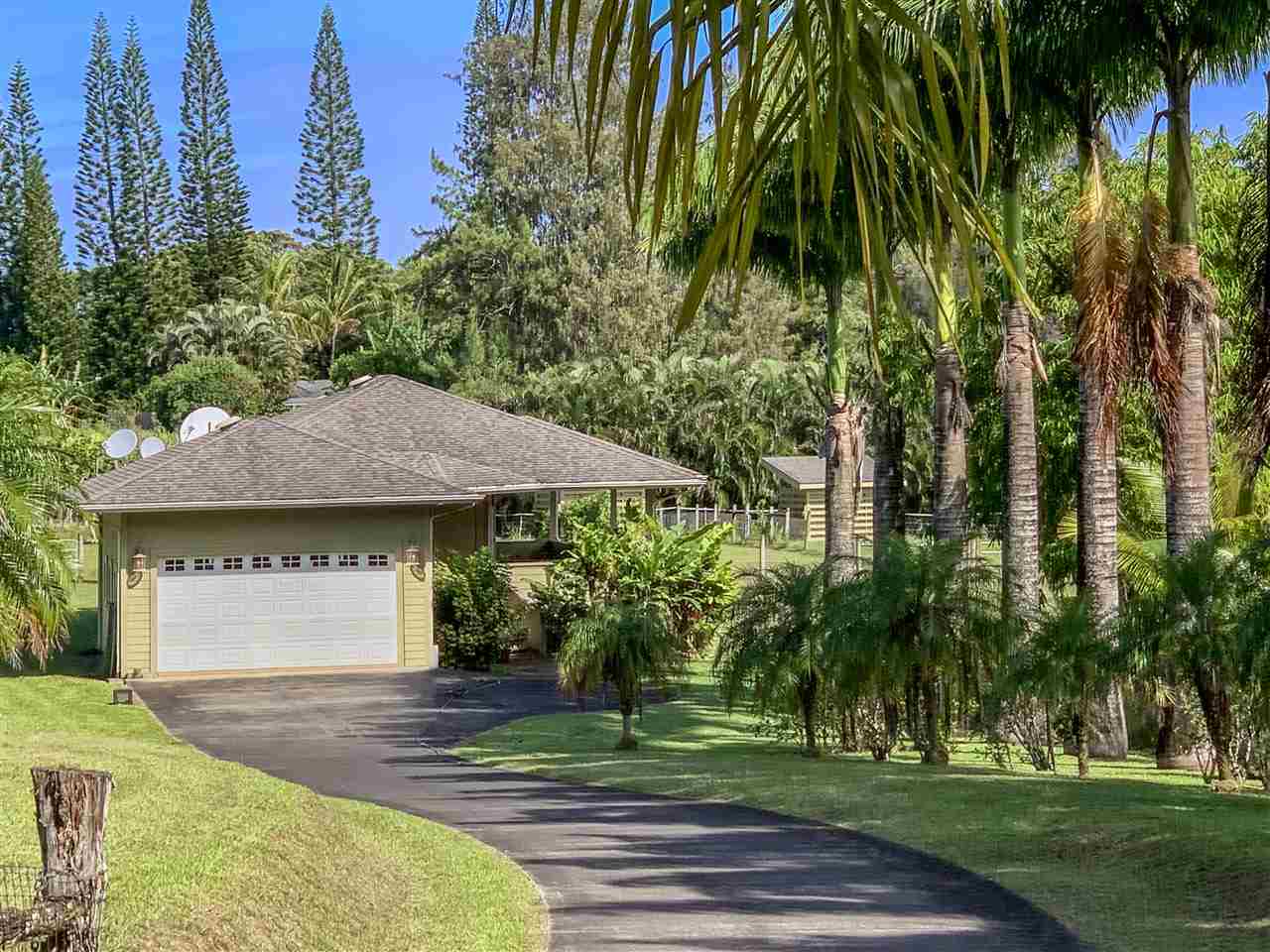 90 Kaupakalua Road Haiku, HI 96708 - Photo 1 of 30 a front view of a house with a yard
