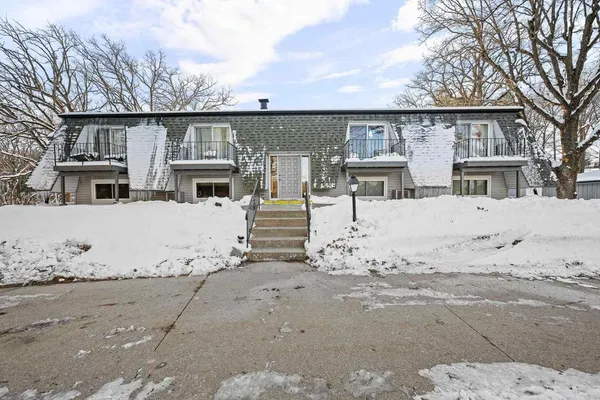 a view of a house with snow on the road