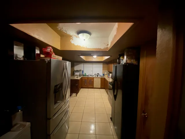 a view of a hallway with a tv