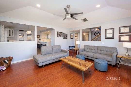 223 West Cobblestone Lane Ridgecrest, CA 93555 - Photo 10 of 34 a living room with furniture and a wooden floor
