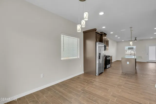 a view of a livingroom with a kitchen