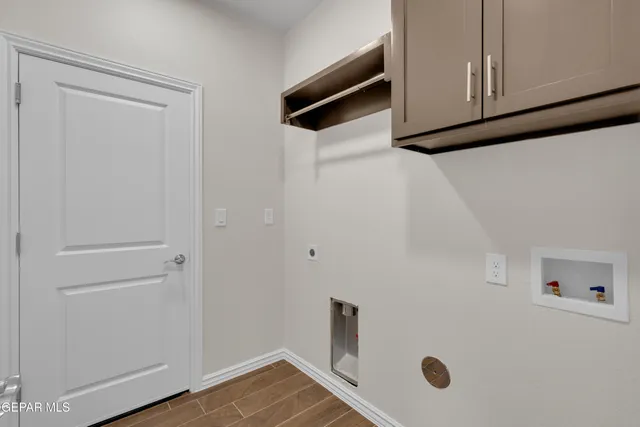 a view of a kitchen with wooden floor