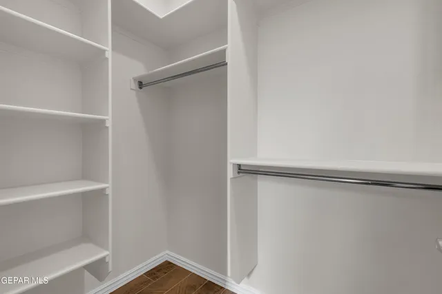 a view of an empty walk in closet