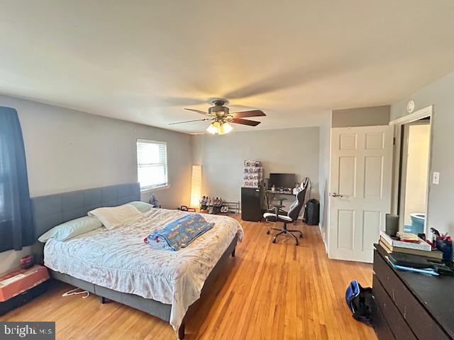 12405 Sweet Briar Road Philadelphia, PA 19154 - Photo 16 of 28 a bedroom with a bed and wooden floor