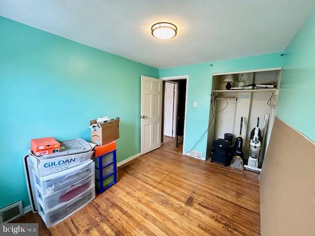 12405 Sweet Briar Road Philadelphia, PA 19154 - Photo 19 of 28 a bedroom with a bed and wooden floor